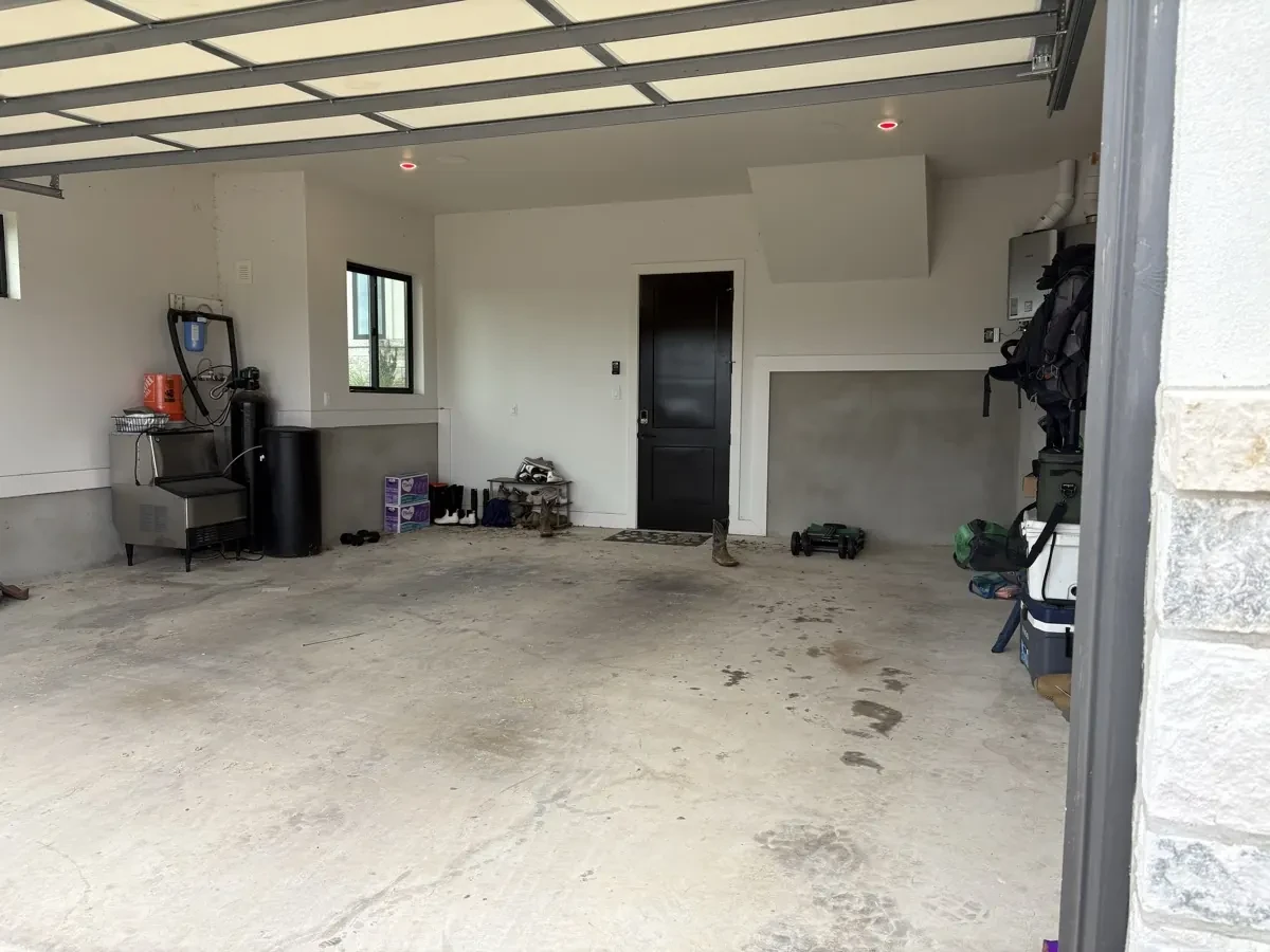 Before photo of garage concrete floor before Mane Floor Coatings project