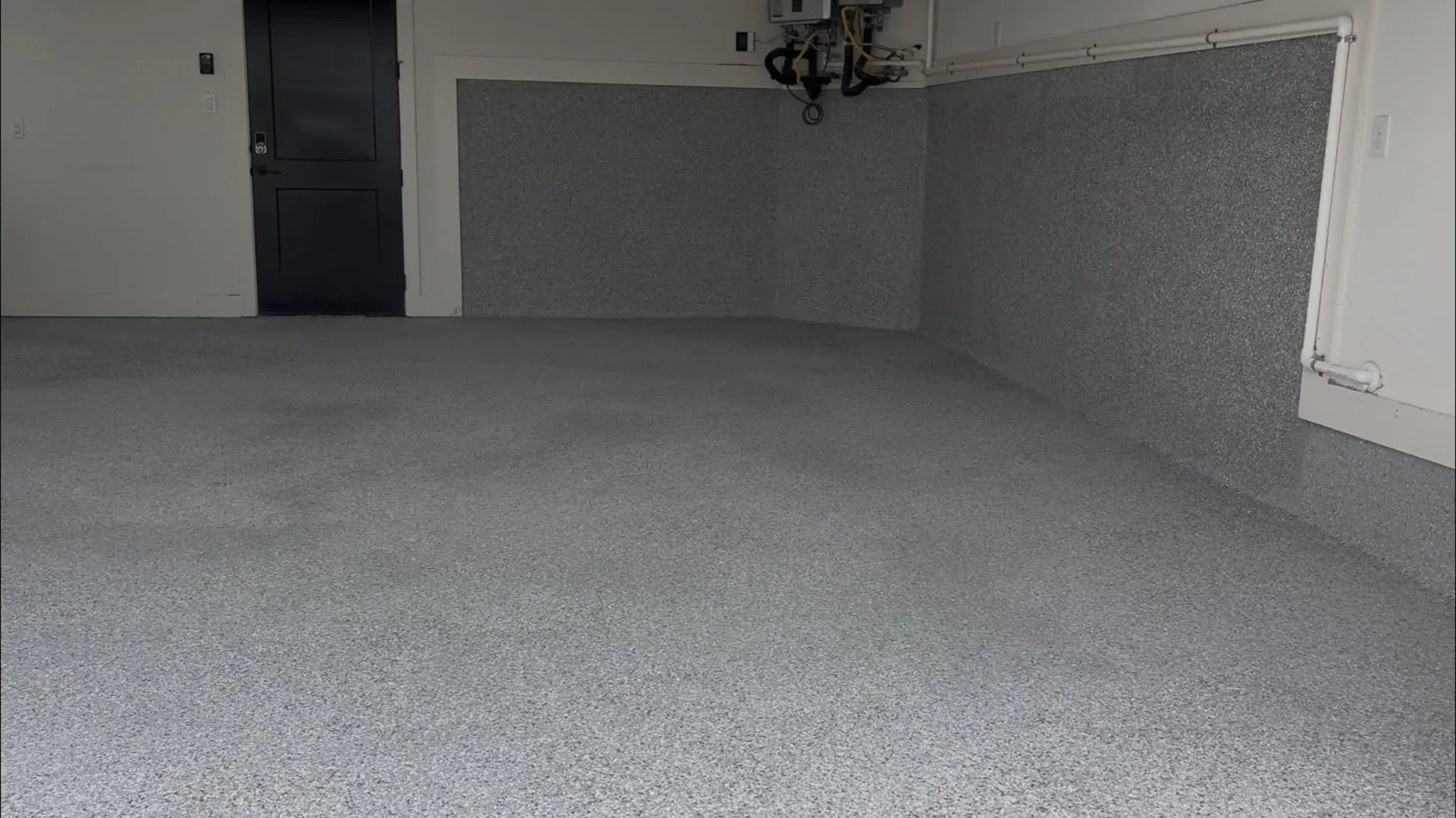 Finished gray flake epoxy garage floor detail by Mane Floor Coatings