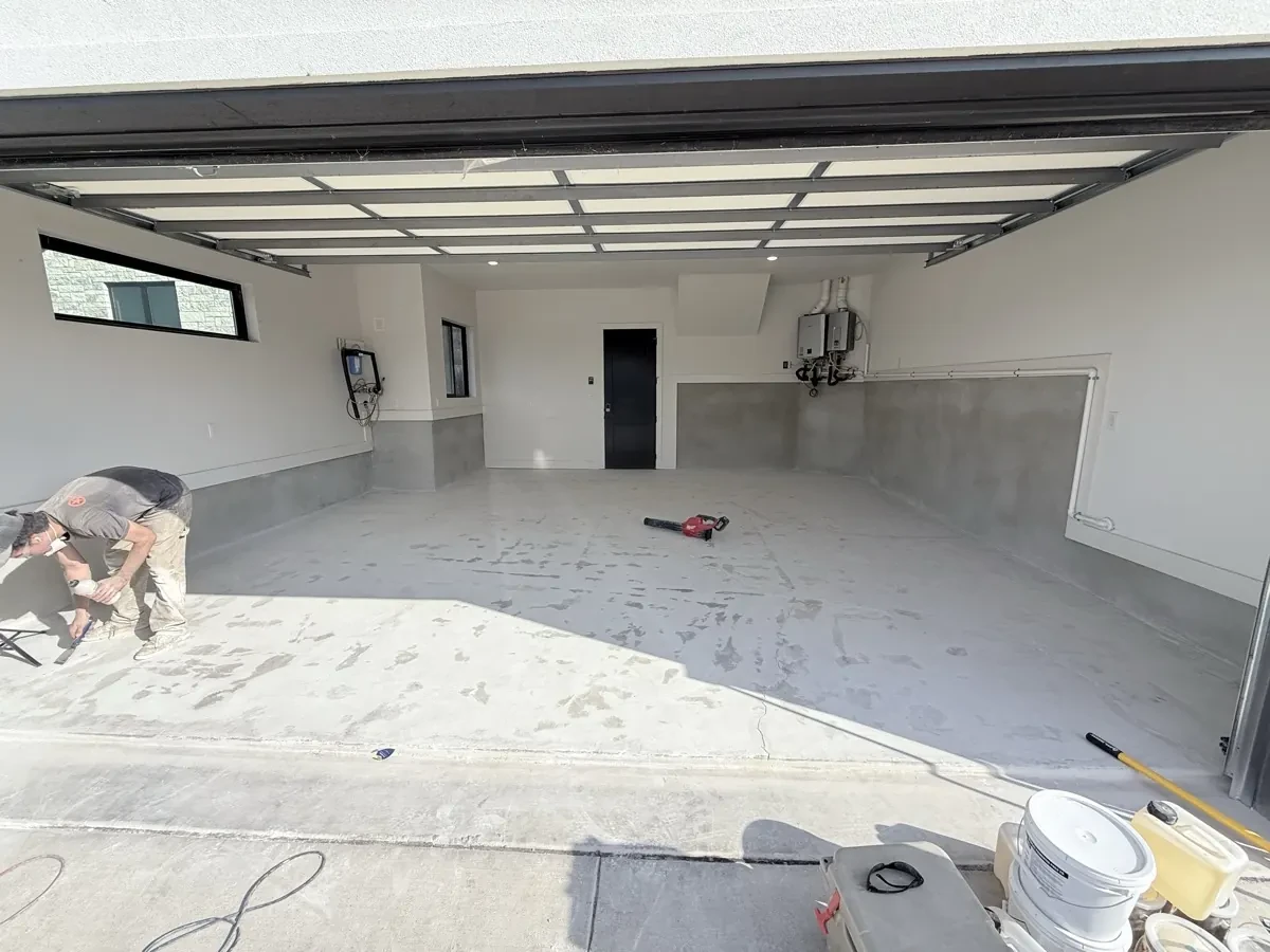 Prepped garage floor before flake epoxy coating by Mane Floor Coatings